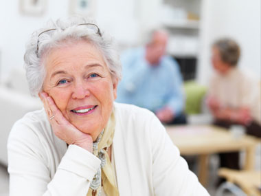 istockphoto_8819243-close-up-of-a-senior-woman-with-friends-in-background